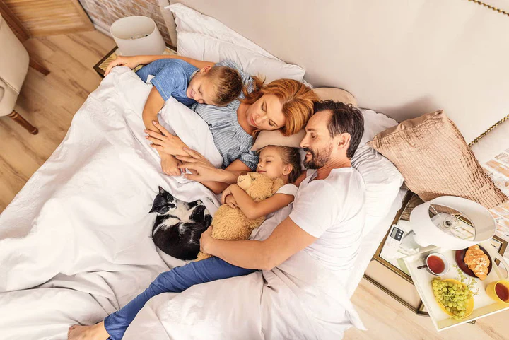 Family in bed altogether